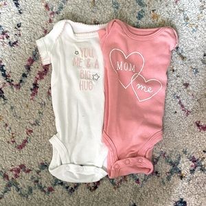 Set of baby girl onesies